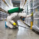 Depositphotos_217639452_s-2019 Pest Control Worker Hand Holding Sprayer For Spraying Pesticides in production or manufacturing factory